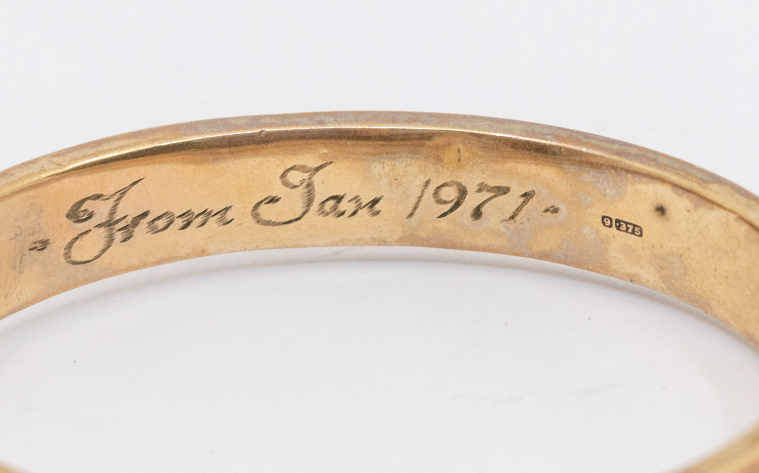 A 9ct gold hollow hinged bangle, engraved decoration to top, width approx 10mm,  inscription to - Image 2 of 2