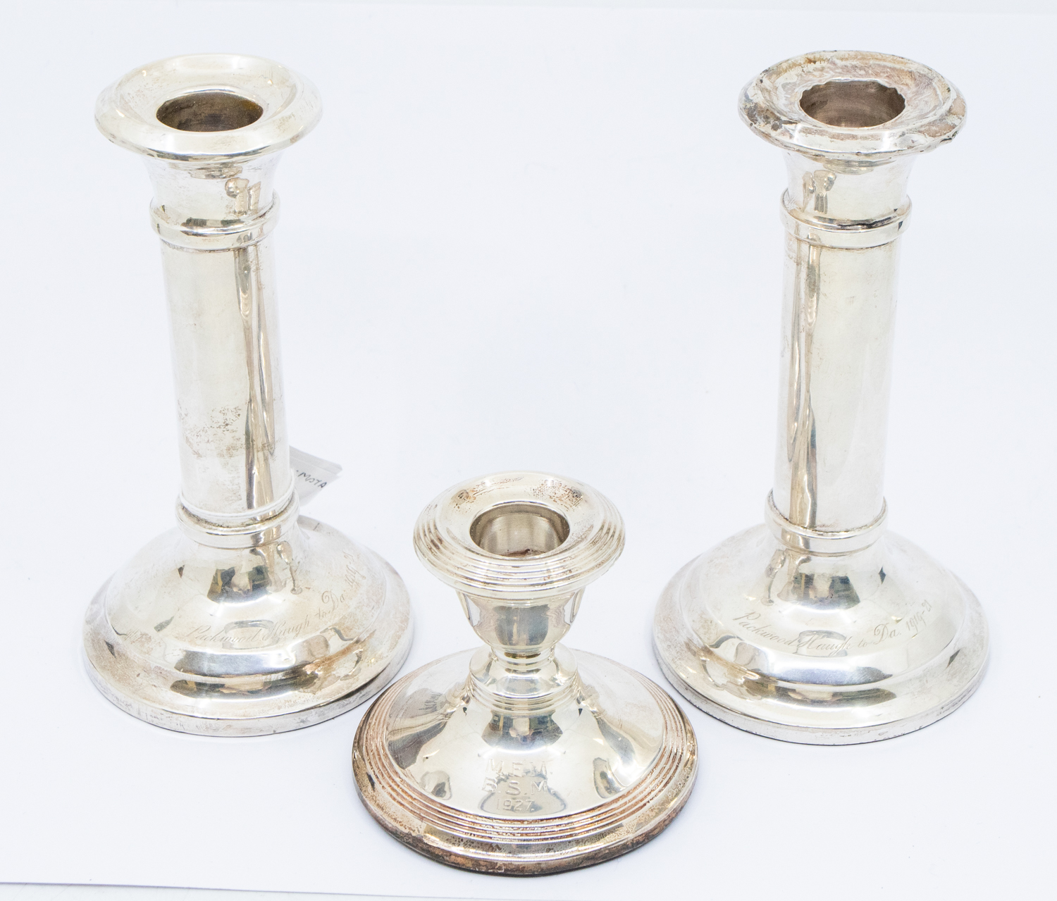 A pair of George V plain Tuscan column candlesticks, with same presentation inscription to base: