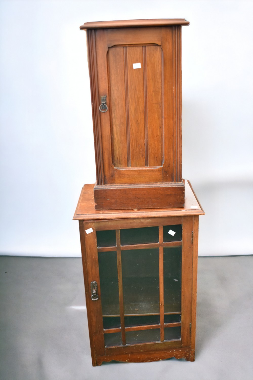 A late 19th Century pot cupboard in mahogany along with an early 20th Century mahogany glazed