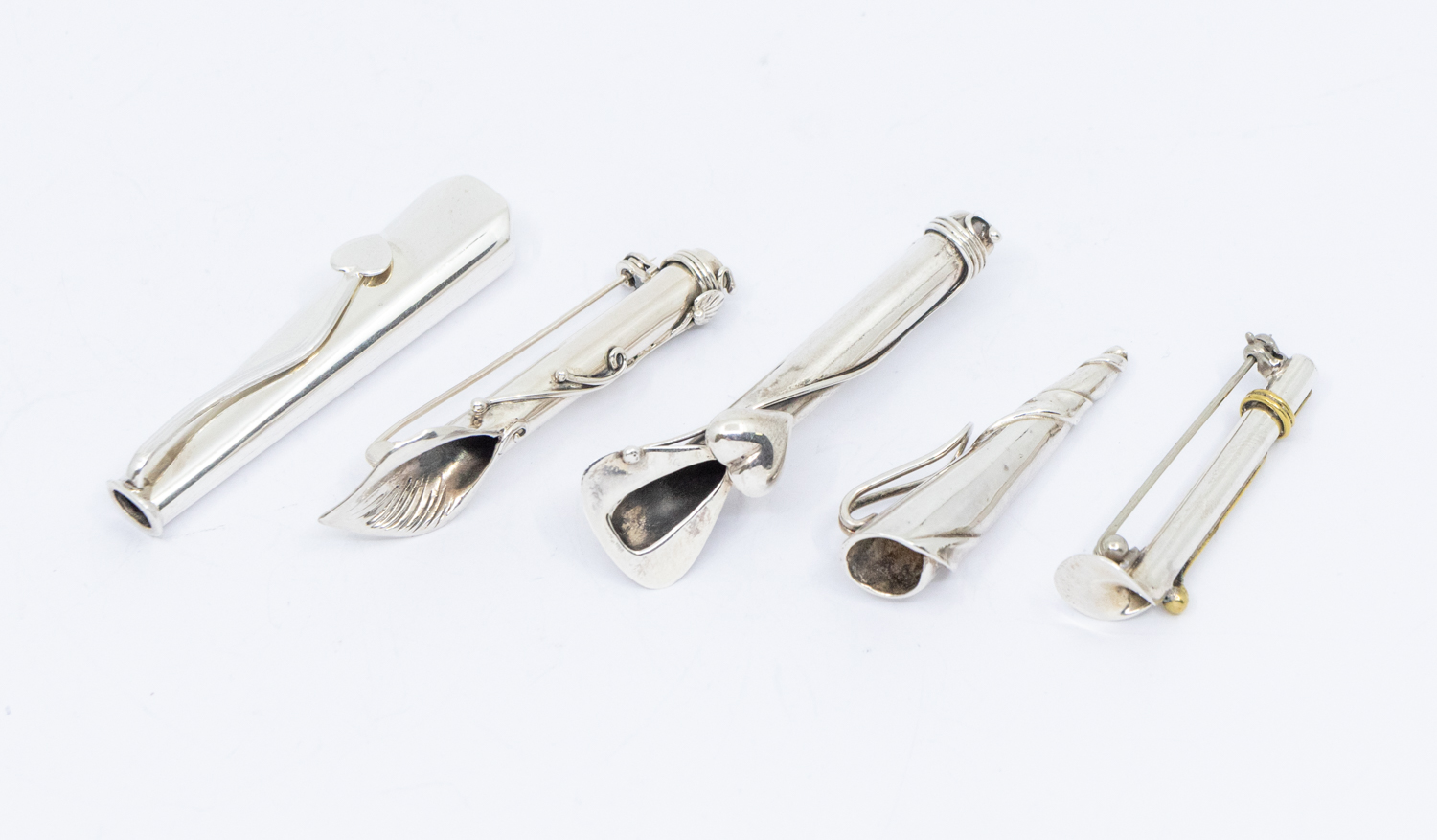 Boutonnieres: a collection of five modern stylish silver buttonhole posy holders, one with applied