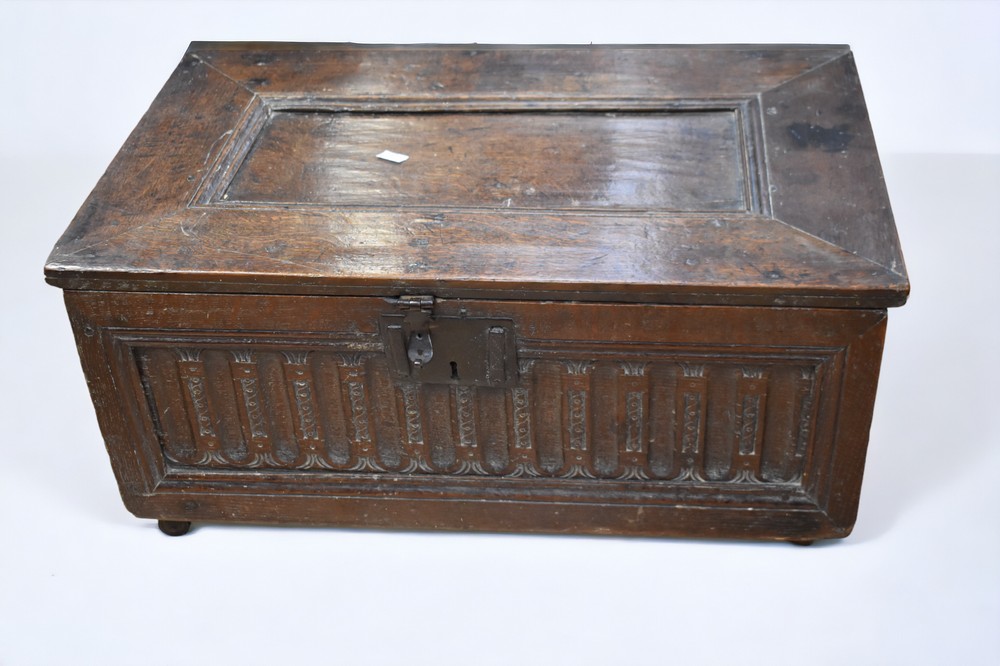 A small 17th Century solid English oak coffer/bible box, with carved front, internal candle box,