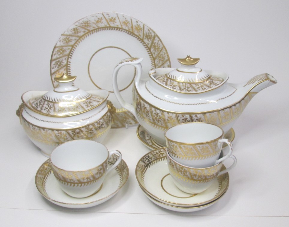 An English Porcelain, possibly John Rose Coalport part tea service with a gilt border to the rim.