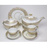 An English Porcelain, possibly John Rose Coalport part tea service with a gilt border to the rim.