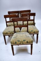 A set of five Georgian mahogany dining chairs