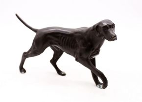 A bronze figure of a hunting dog.