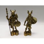 A near pair of 20th century weighty brass figural doorstops of possible Vikings.