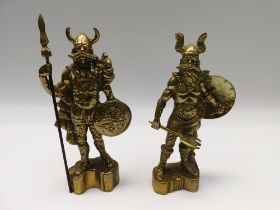 A near pair of 20th century weighty brass figural doorstops of possible Vikings.