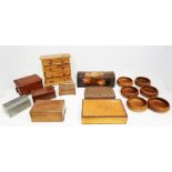 A collection of 20th Century treen boxes with treen bowls.