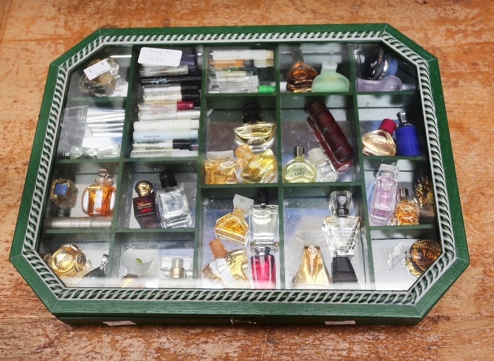 A collection of various miniature perfume bottles and samples, to include Boucheron, Yves Rocher,