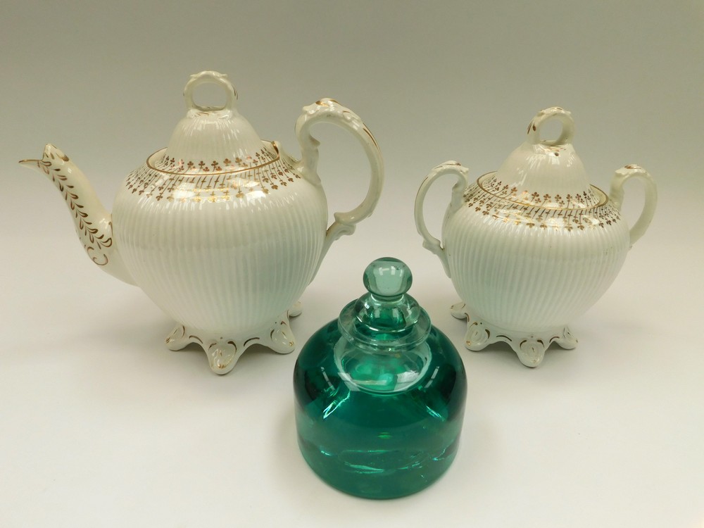 A mid 19th Century porcelain tea pot with sugar bowl and lid along with an early 20th Century ink