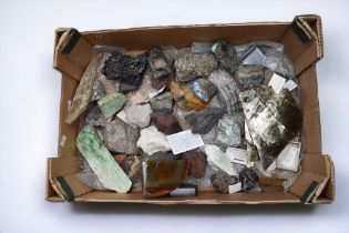 A collection of various rocks and minerals including carborundum, meteorite, tourmaline, boulder