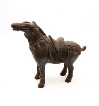 A 20th century Tang style cast metal horse figure.