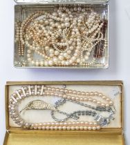 A box of costume jewellery including faux pearls, paste set brooch and necklace etc