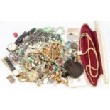 A collection of vintage costume jewellery to include silver charms, faux pearls and beaded necklace,