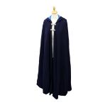 A navy wool opera cape with hood, fully lined in cobolt blue cotton, two double clips decorative