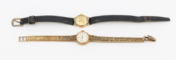 Omega- a ladies vintage 9ct gold Omega wristwatch, comprising a small round signed silvered dial