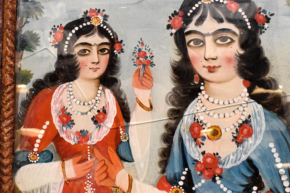 A pair of 19th century Indo-Persian reverse glass paintings, each a pair of young women of the Qajar - Image 2 of 5