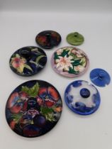 A Moorcroft Pomegranate preserve jar lid c1920 (scratched) together with a Moorcroft Pansy candy box