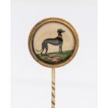 An Essex crystal gold stick pin, comprising a round crystal depicting a Greyhound, within a beaded