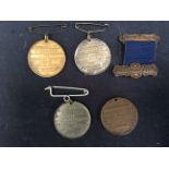 A small collection of four metal West Bromwich Education Committee medals, all awarded to E.