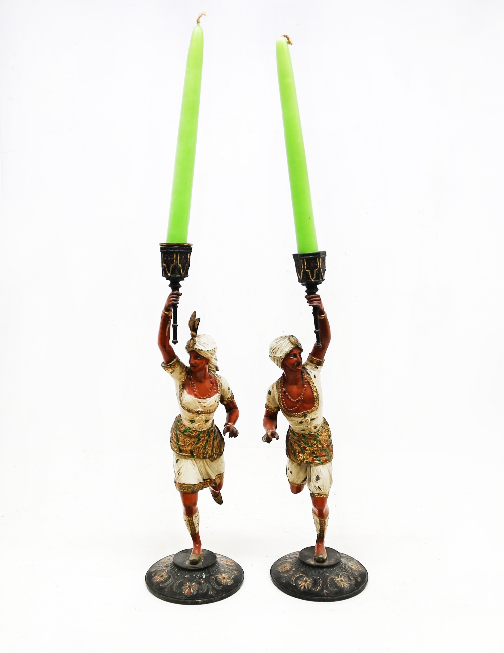 A pair of early 20th Century gold painted continental Arabic figures/candle holders.