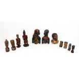 A collection of carved wooden African figures and heads.