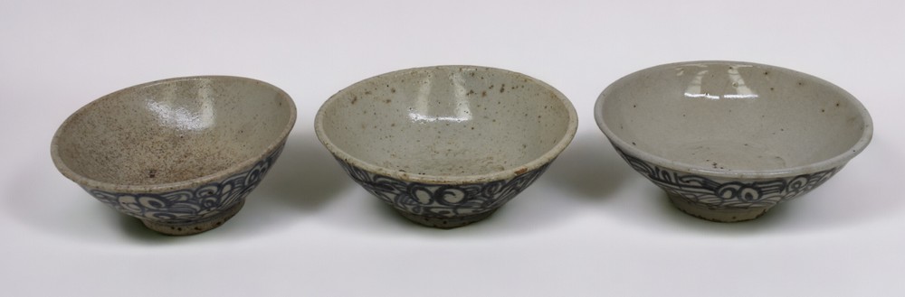 Three 19th century Asian provincial bowls with blue painted decoration, possibly Swatow, each with