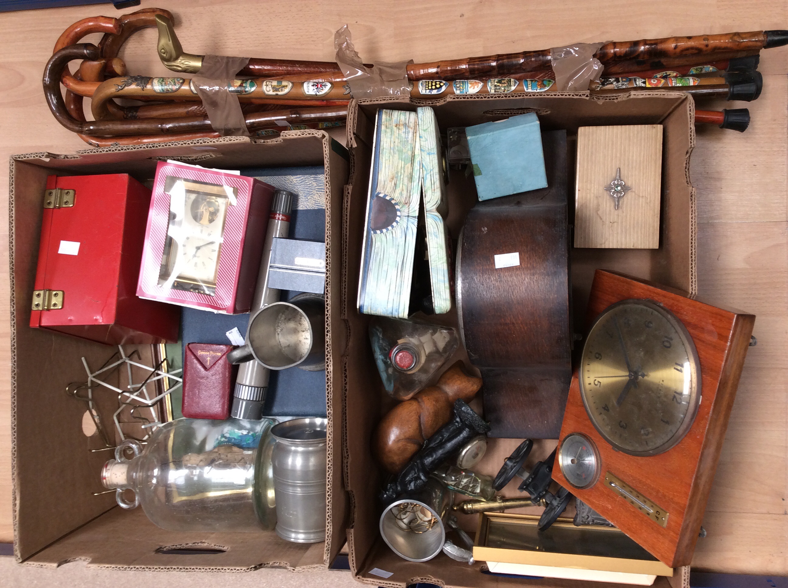 A collectors lot containing mantle clock, walking sticks, ships in bottles, coins, costume