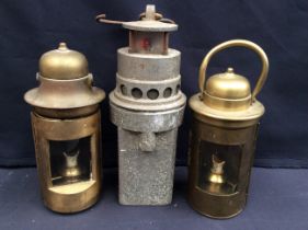 Two brass hand held oil lamps along with an International gas detector lamp.