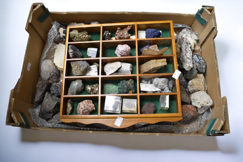 A collection of various rocks and minerals including opal, desert rose, slate, lava stone, iron