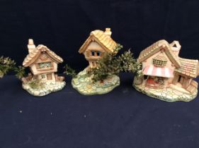 Three Pendelfin large sculptural models to include; Castle Tavern, Cobble Cottage and Fruit Shop (