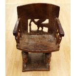A late 19th Century/early 20th Century solid hard wood African tribal seat/chair with bird and