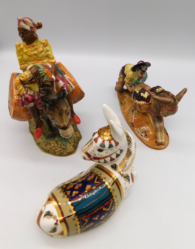 A gold-stopper Royal Crown Derby paperweight of Donkey, 'Thistle' edition of 1500, and two Beswick