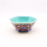 A Chinese polychrome porcelain bowl, late 19th century, comprising a hexagonal form, decorated