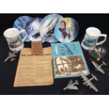 A collection of WWII cabinet plates and tankards, model planes and other WWII ephemera.