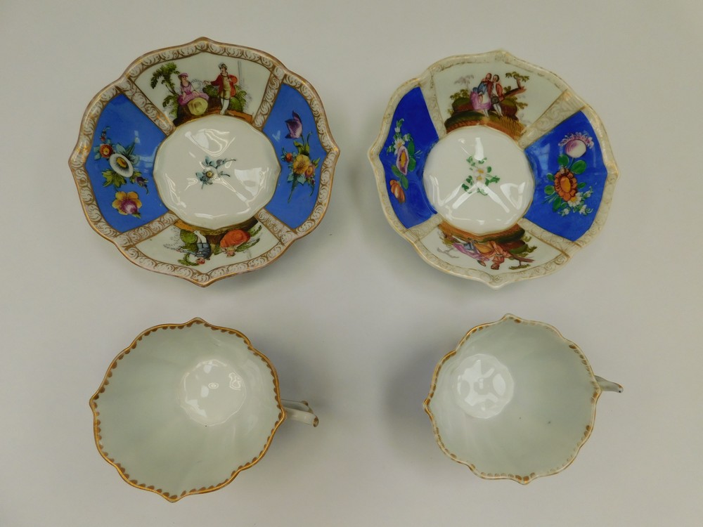 Two Dresden tea cups and saucers with two blue panels with floral sprays and two panels with - Image 2 of 2