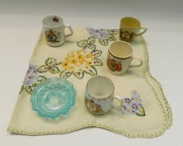 A mixed lot to include; commemorative mugs of various designs, blue moulded glass bowls, Continental