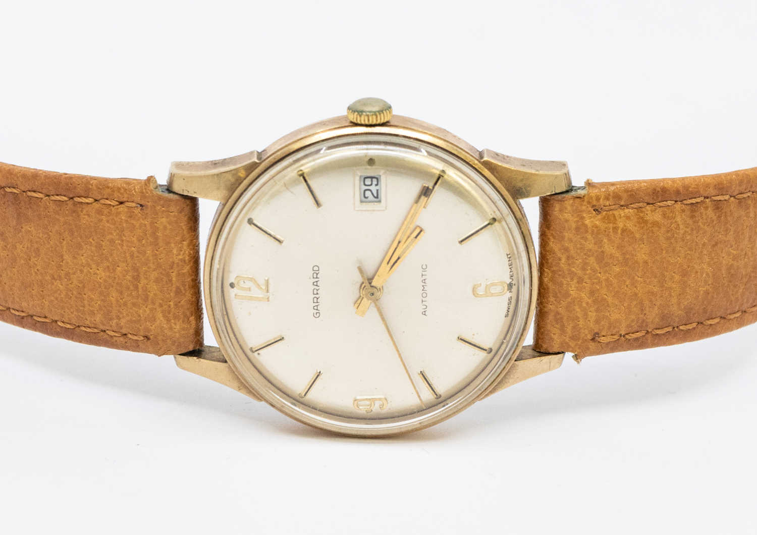 Garrard- a gentleman's 9ct gold cased automatic wristwatch, comprising a signed silvered dial with
