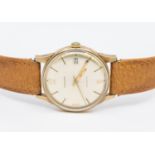 Garrard- a gentleman's 9ct gold cased automatic wristwatch, comprising a signed silvered dial with