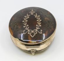 A George V silver and tortoiseshell trinket box, with inlaid foliage designed silver work, on
