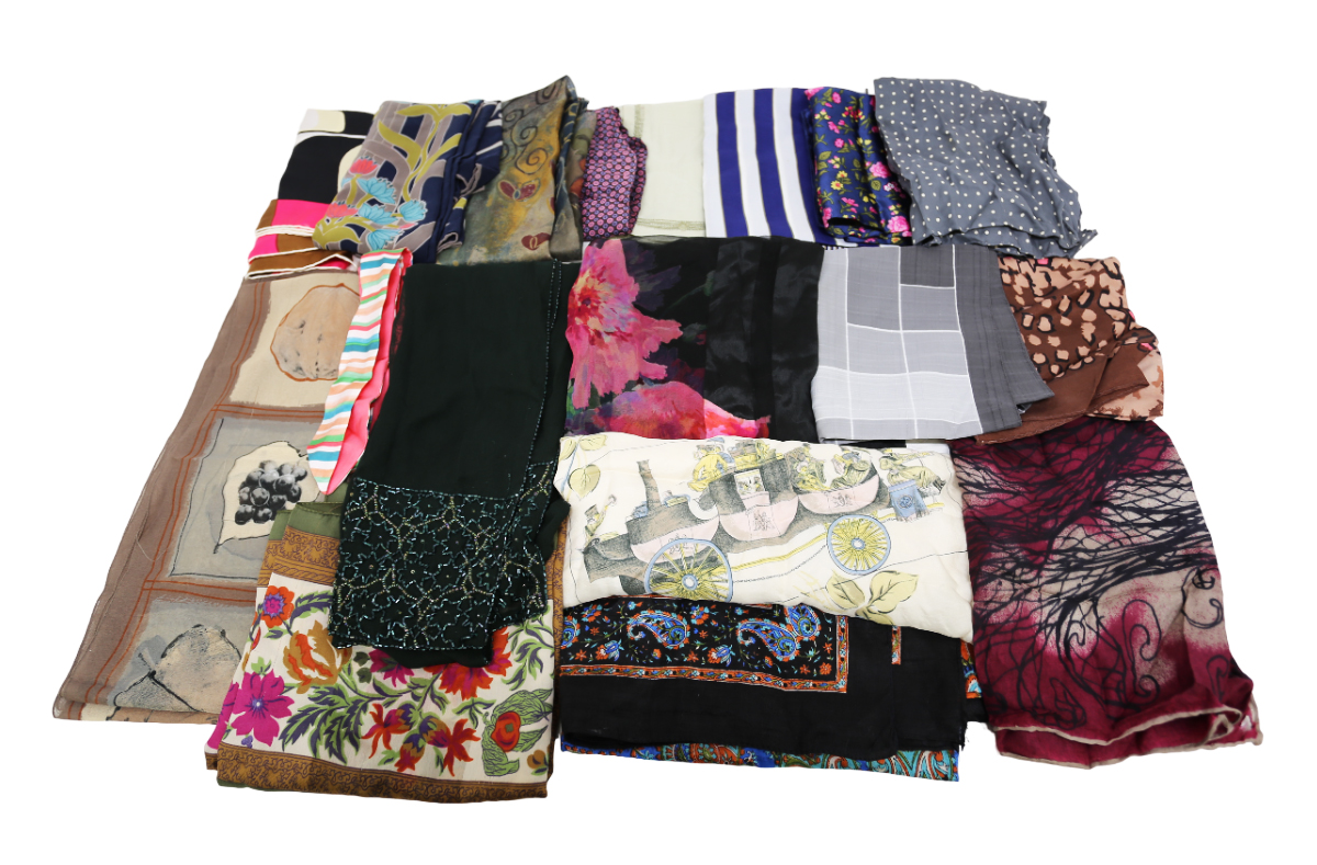 A large collection of silk squares and scarves in rayon and man-made fibres. An interesting lot