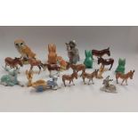 A collection of Beswick donkey figurines, together with Wade Heath rabbits, various other factory