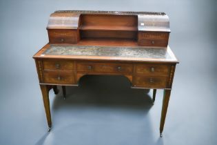 An inlayed Edwardian mahogany ladies desk with central drawer flanked by two either side drawers,