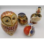 Royal Crown Derby paperweights - four to include; an unboxed Owl and three boxed to include: Puffin,