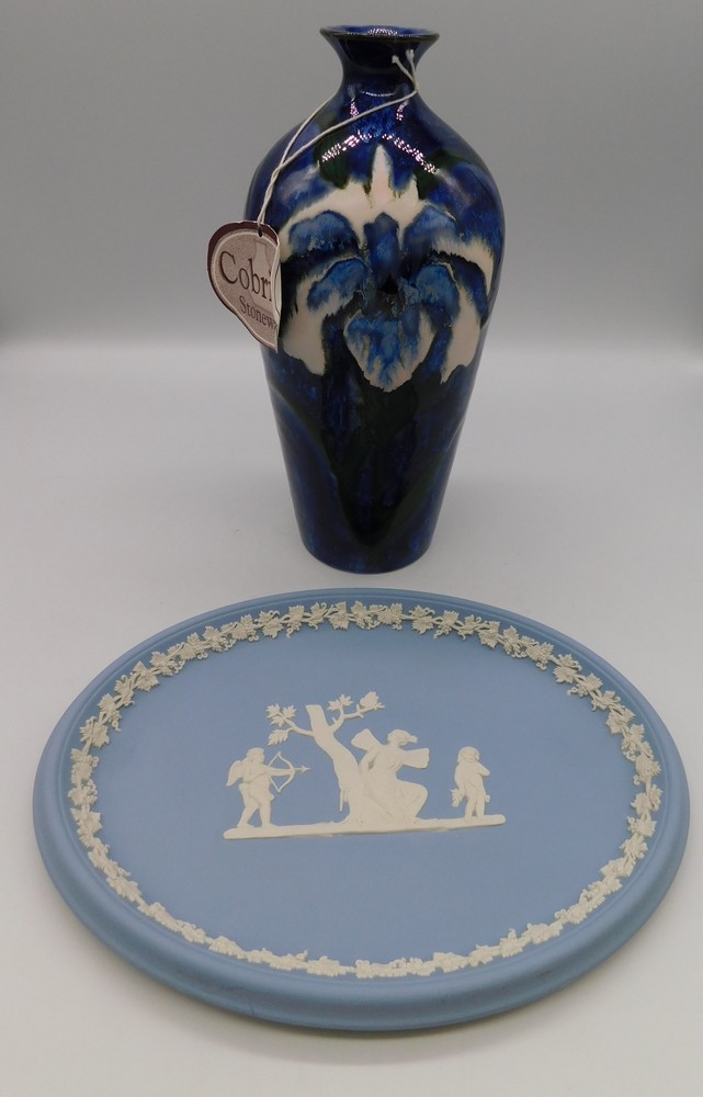 A Cobridge Stoneware Trial vase with an Iris on a Blue Ground ,Anita Harris initial to base, year