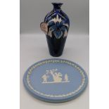 A Cobridge Stoneware Trial vase with an Iris on a Blue Ground ,Anita Harris initial to base, year