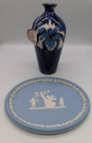 A Cobridge Stoneware Trial vase with an Iris on a Blue Ground ,Anita Harris initial to base, year