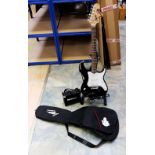 An electric Lyon by Washbourn guitar in black gloss on stand with case and amp.