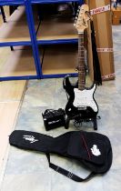 An electric Lyon by Washbourn guitar in black gloss on stand with case and amp.