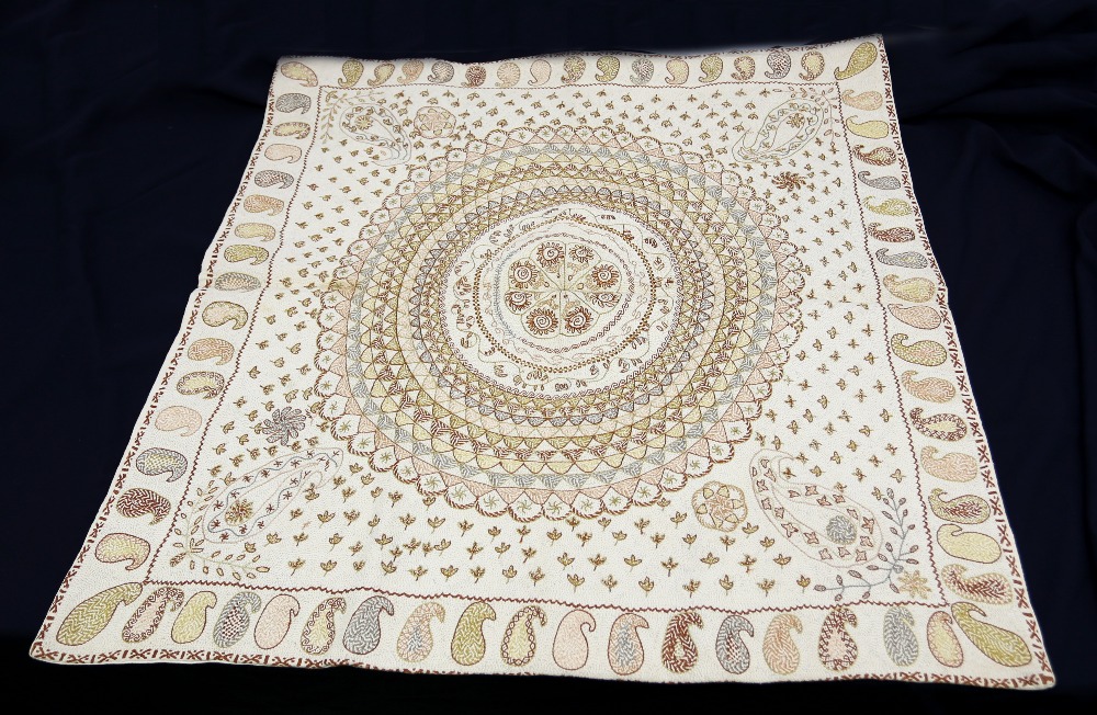 A Bangladeshi floor cushion with kantha embroidery , thread is pale gold, fawn and green, backed